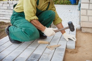 Mason making sidewalk